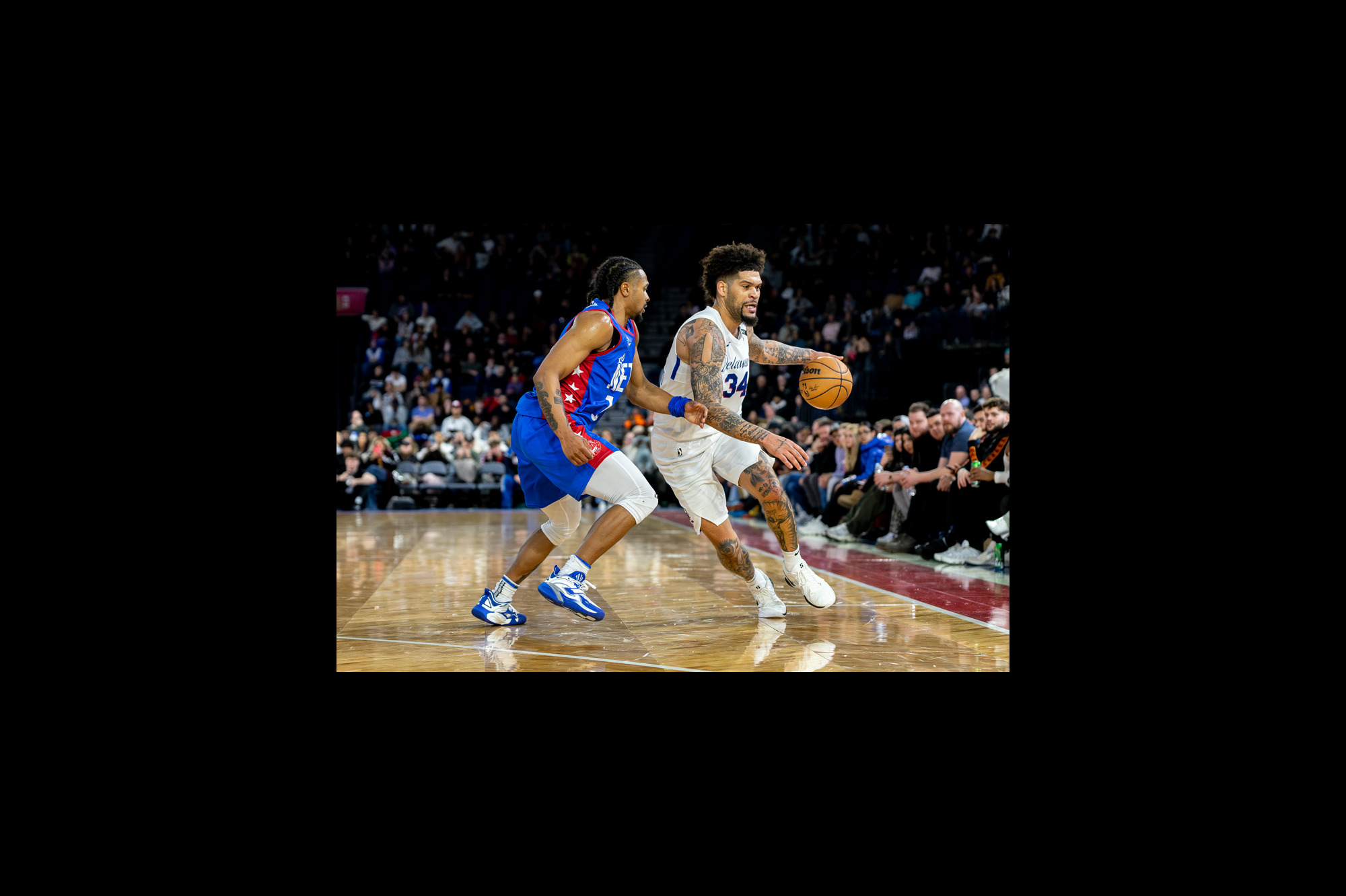 Delaware Blue Coats' Jarron Cumberland is guarded by Long Island Nets Tyson Etienne on February 8, 2025. | Photo: Kieron Yates